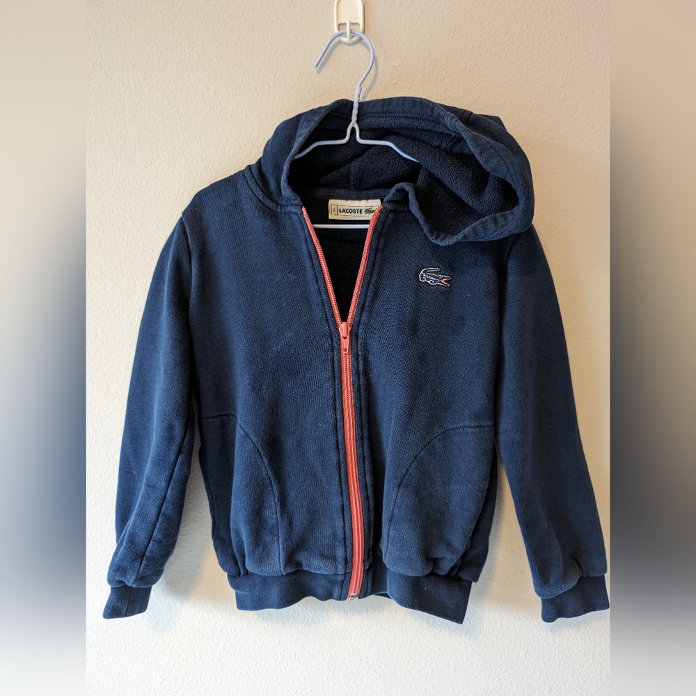 Kids Lacoste zip up hoodieWarm. Comfortable. Durable. An essential from the Laco